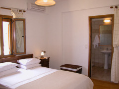 Villa Eleftheria's master bedroom with en-suite shower room