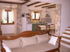 Open-plan lounge and kitchen in Villa Kalithea